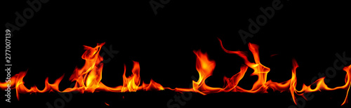 Fire flames on Abstract art black background  Burning red hot sparks rise  Fiery orange glowing flying particles