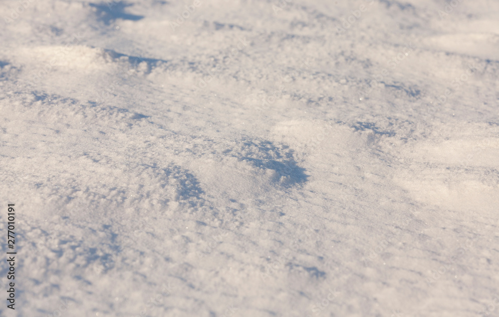 Snow drifts in winter - the territory covered with snow in the winter season. Photo taken in close-up Snow drifts in winter - the territory covered with snow in the winter season. Photo taken in close-up