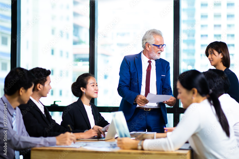 Business Team work concept. Modern businessman explaining his ideas to colleagues at seminar Business Team work concept. Modern businessman explaining his ideas to colleagues at seminar