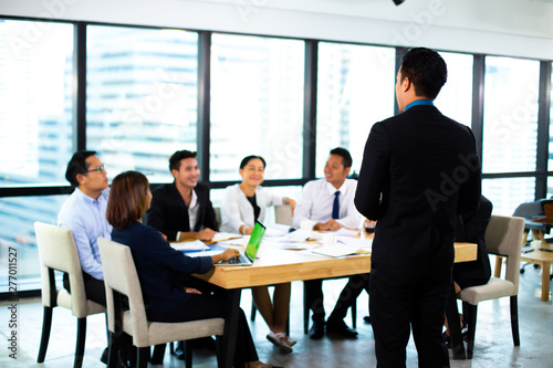 Business Team work concept. Modern businessman explaining his ideas to colleagues at seminar