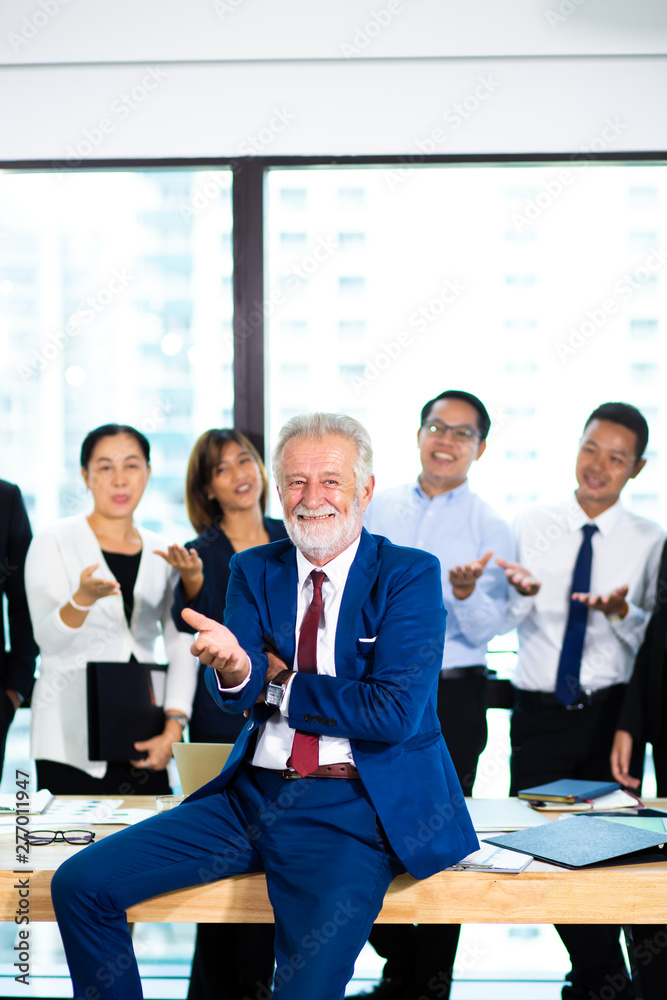 business teamwork concept. Group of business people with businessman leader on foreground business teamwork concept. Group of business people with businessman leader on foreground