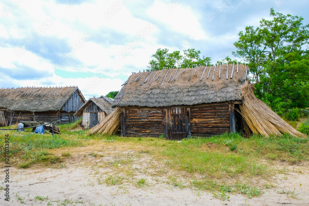 Folk oldest habitation under a reed roof in the disappearing village of Svalovichi in the Ukraine. Ukrainian Polissya.