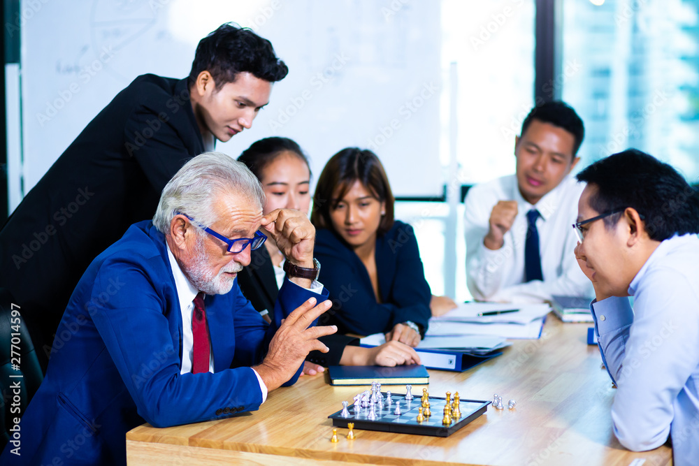 Multi-ethnic business people having discussion at conference table in office Multi-ethnic business people having discussion at conference table in office
