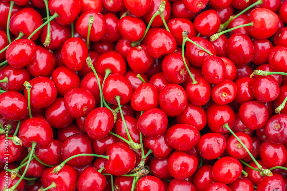 Fresh sweet red cherry texture. Ripe sweet cherry. Summer berry. Garden harvest. Fresh berries. Harvest of sweet cherries. Ripe red cherry close-up. Fresh sweet red cherry texture. Ripe sweet cherry. Summer berry. Garden harvest. Fresh berries. Harvest of sweet cherries. Ripe red cherry close-up.