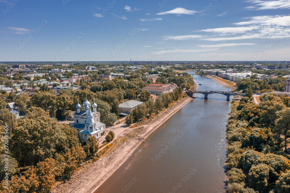 Scenic aerial view of river in ancient touristic town Vologda in Russian Federation. Beautiful summer sunny look of water in urban area of capital of russian province