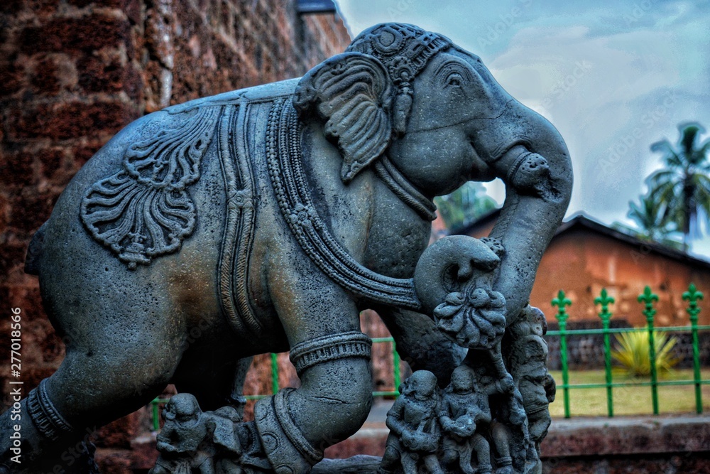 An elephant sclupture outside a temple An elephant sclupture outside a temple