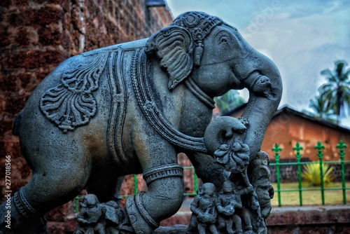 An elephant sclupture outside a temple