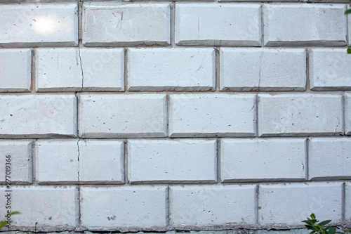 white wall from concrete blocks with big crack