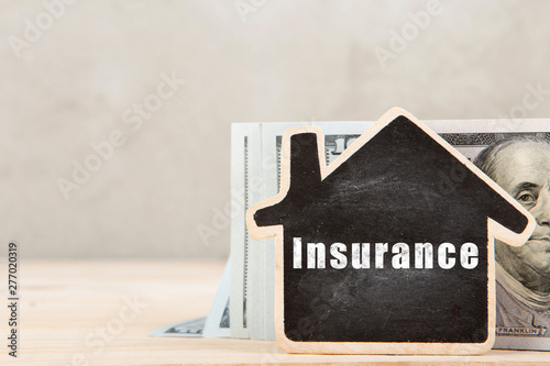 Real estate concept - little house with inscription Insurance