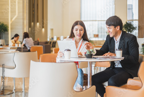 Young Asian business people and salesman broker discussing about insurance and financial investment planning in working office