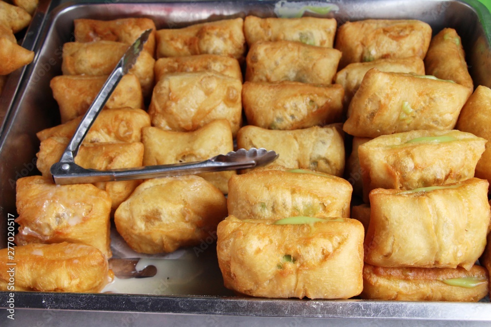 Deep fried dough put thai pandan custard Deep fried dough put thai pandan custard
