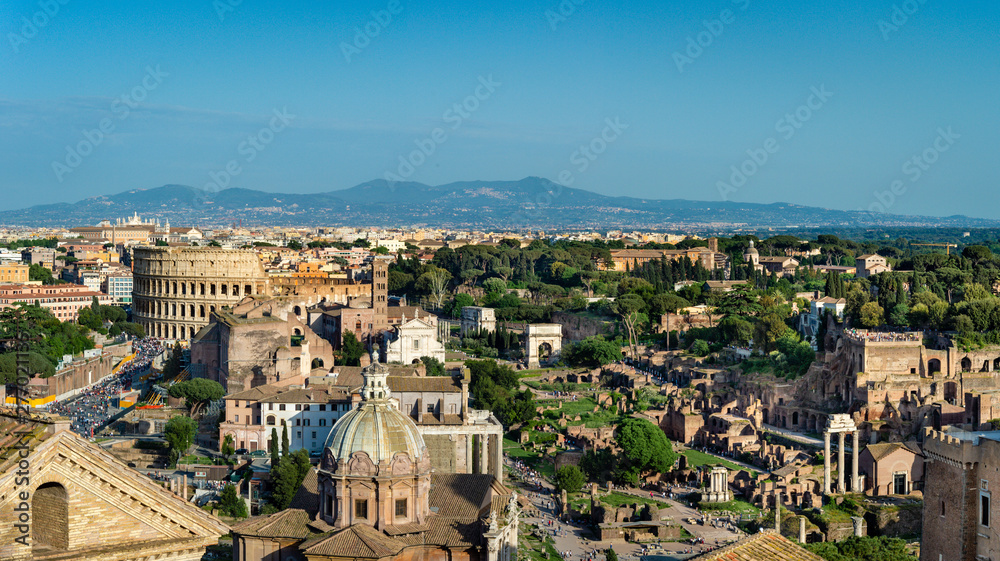 Panoramic  sunset view of  Colosseum and Roman Forum  in Rome.