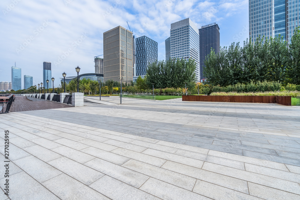 Panoramic skyline and buildings with empty square floor.