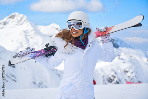  Young caucasian woman skier . Winter sports and leasure activities