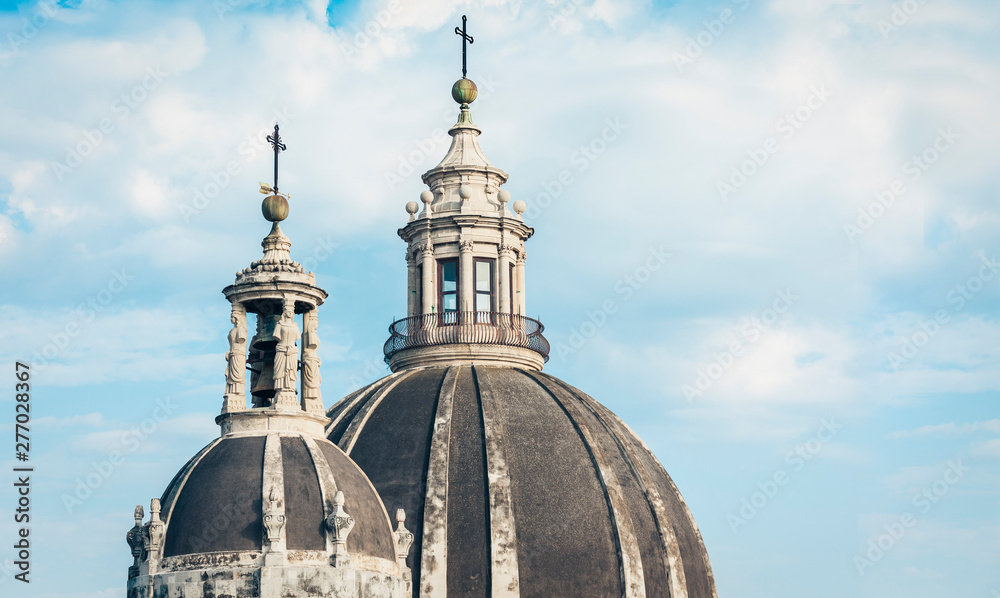 Domes of the Cathedral dedicated to Saint Agatha. The view of the city of Catania, Sicily, Italy .