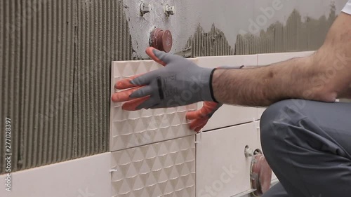 Laying tiles in bathroom