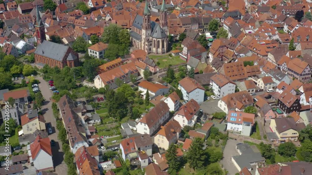 Aerial of the town Ladenburg in Germany beside the neckar river on a sunny day in spring. Round pan to the right across the old part of town. Aerial of the town Ladenburg in Germany beside the neckar river on a sunny day in spring. Round pan to the right across the old part of town.