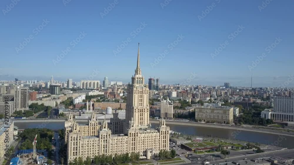 Aerial view of hotel Ukraine in Moscow. Old Soviet Russia Stalin high-rise skyscrapers in heart of modern Moscow City. Kutuzov avenue day traffic. Aerial view of hotel Ukraine in Moscow. Old Soviet Russia Stalin high-rise skyscrapers in heart of modern Moscow City. Kutuzov avenue day traffic.