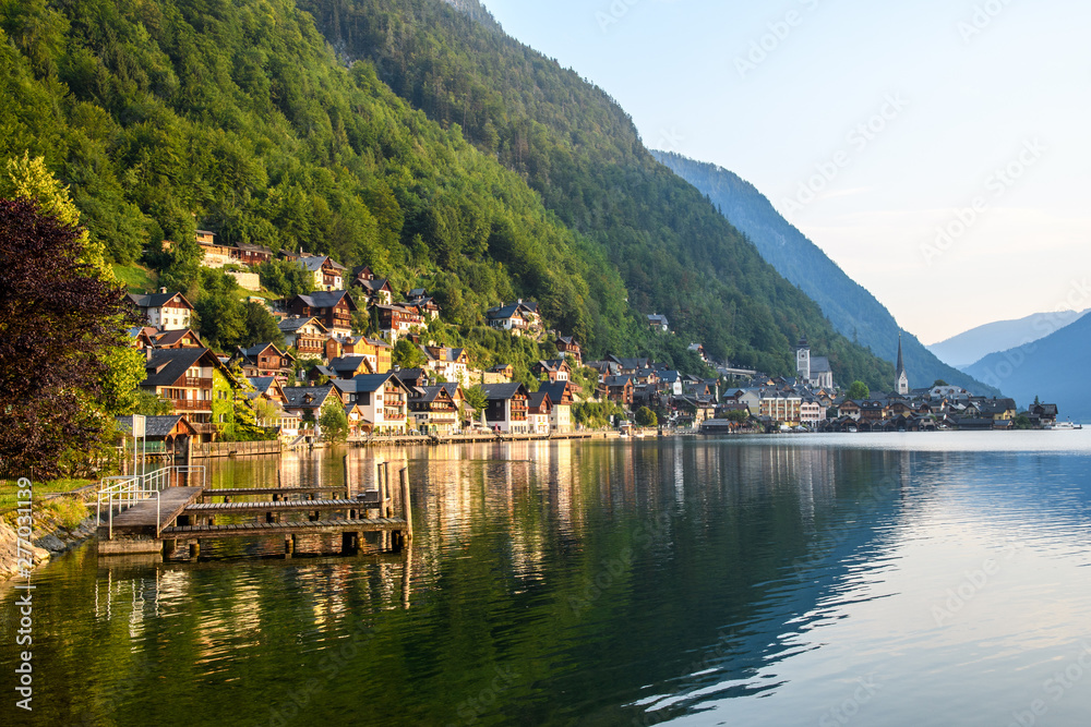 Early morning in an ancient Austrian city on the shore of an Alpine lake among the mountains.