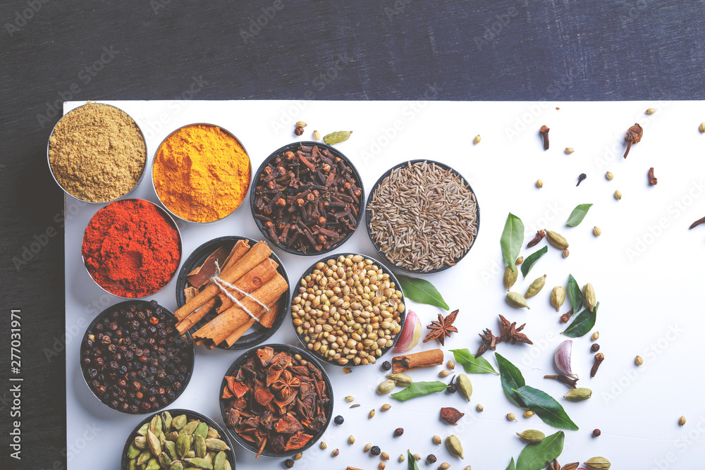 Various spices in a bowls on white background. Top view with copy space. Various spices in a bowls on white background. Top view with copy space.