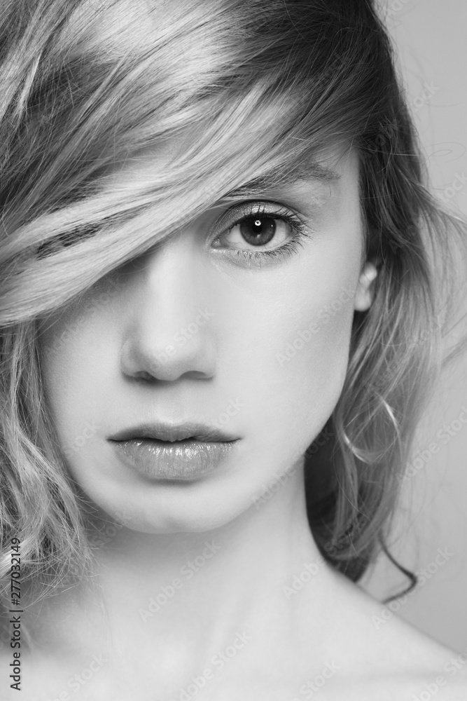 Black and white close-up portrait of young beautiful woman with long hair Black and white close-up portrait of young beautiful woman with long hair