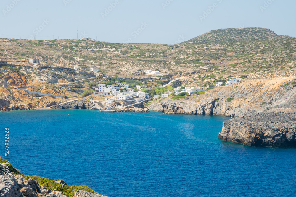 Panorama of the bay of Antikythera with deep blue sea waters where the port of the islan is located in Potamos village, Greece Panorama of the bay of Antikythera with deep blue sea waters where the port of the islan is located in Potamos village, Greece