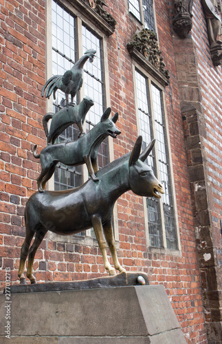 Bremen, Germany - 06/13/2019: famous sculpture of Bremen musicians. Bronze monument of fairytale animals. Heritage of Grimm brothers. Fairytales concept. Bremen sightseeing. Bremen landmark. 