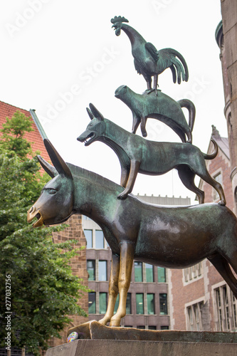 Bremen, Germany - 06/13/2019: famous sculpture of Bremen musicians. Bronze monument of fairytale animals. Heritage of Grimm brothers. Fairytales concept. Bremen sightseeing. Bremen landmark. 