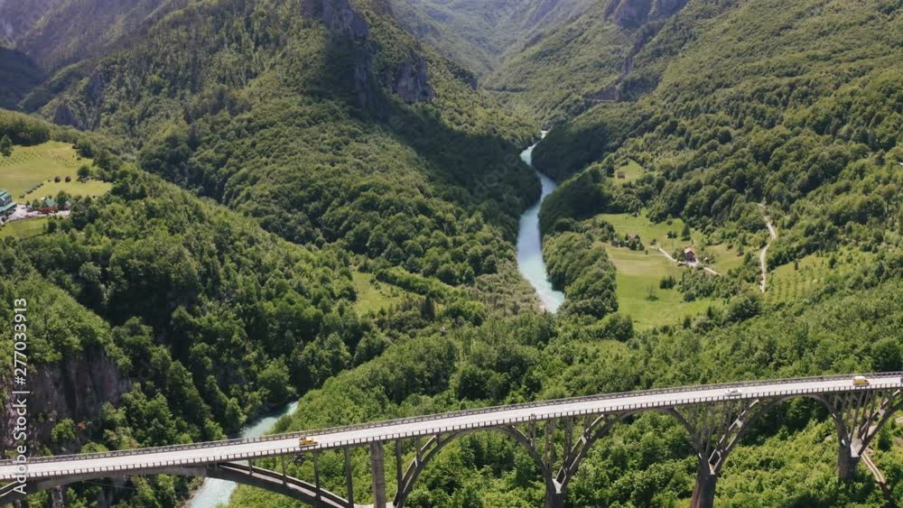 Aerial view footage of Durdevica Tara arc bridge in the mountains of Montenegro