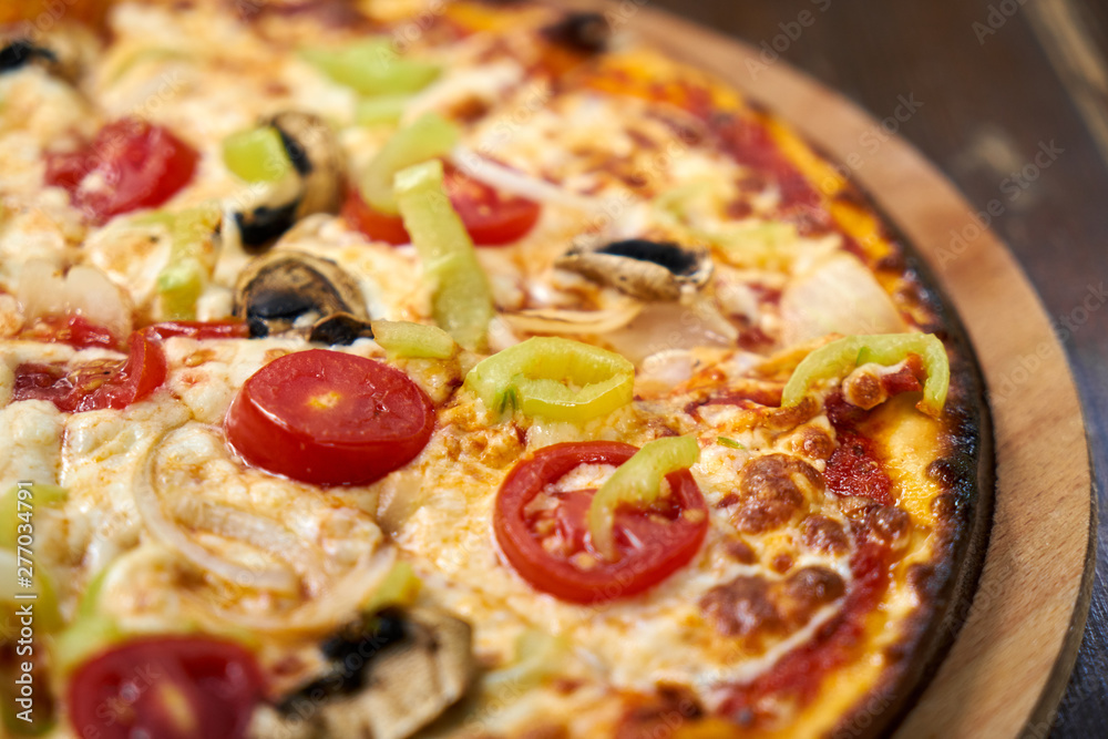 Delicious pizza with vegetables on the table Delicious pizza with vegetables on the table