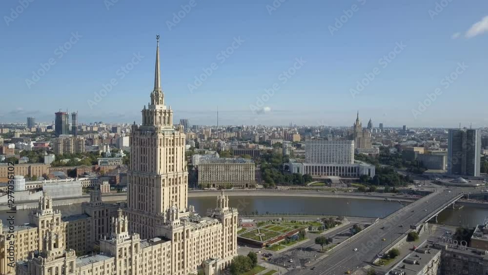 Aerial view of hotel Ukraine in Moscow. Old Soviet Russia Stalin high-rise skyscrapers in heart of modern Moscow City. Kutuzov avenue day traffic. Aerial view of hotel Ukraine in Moscow. Old Soviet Russia Stalin high-rise skyscrapers in heart of modern Moscow City. Kutuzov avenue day traffic.