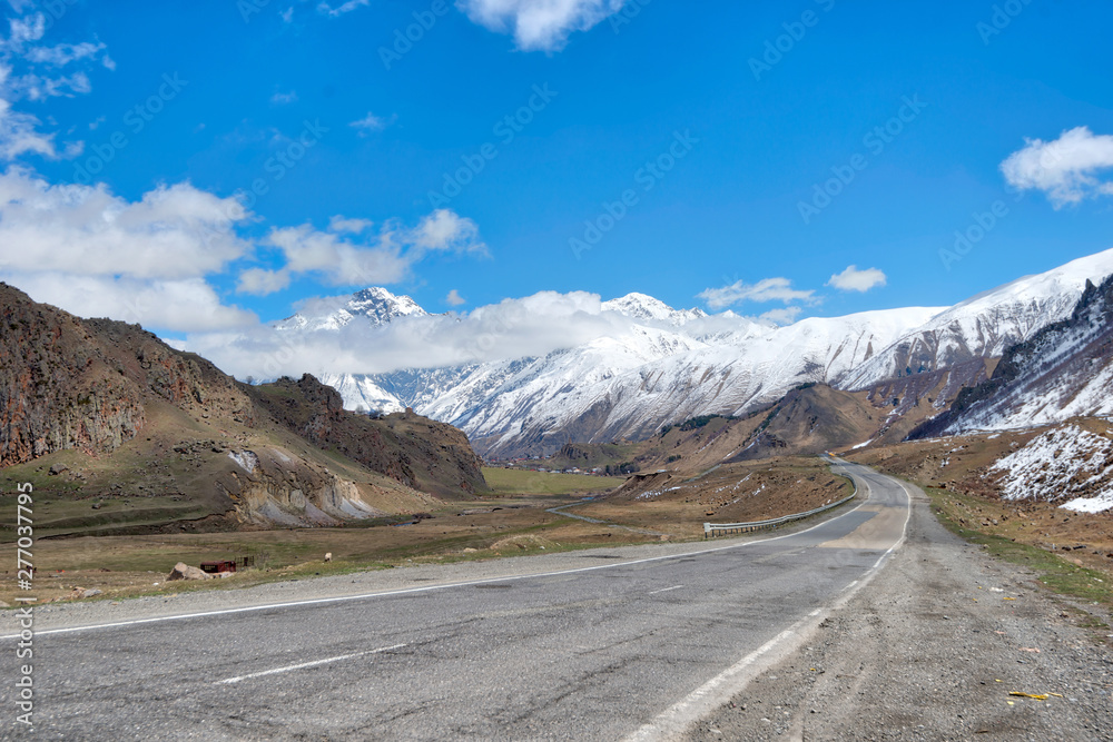 Naklejka premium E117 Leading North in Georgia close to Gergeti Trinity Church and Mt Kazbek, taken in April 2019\r\n' taken in hdr