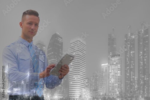 double exposure business.Mixed media of business man working on tablet . 