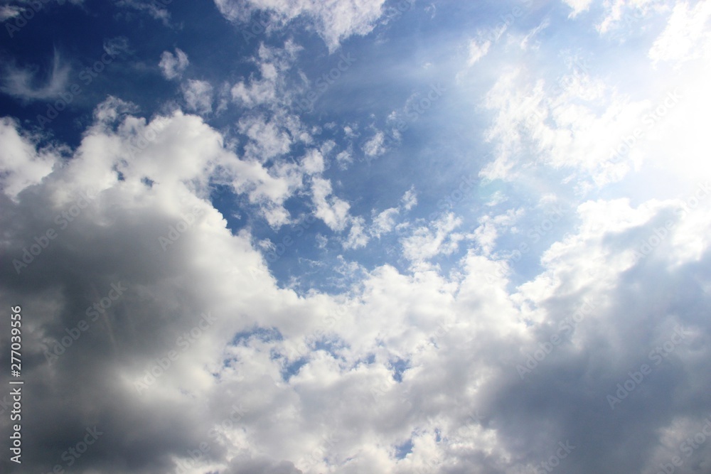 clouds in the spring sky, all shades of blue. running in the sun clouds in the blue sky immediately after the rain, selective focus.