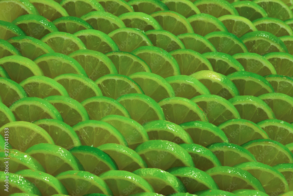 Obraz premium Fresh lime slices as a background.