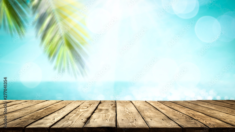 Desk of free space and summer beach background 