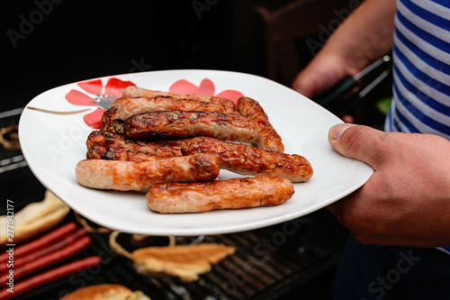 Fried sausages, frankfurters, hot dogs for barbecue. Summer grill