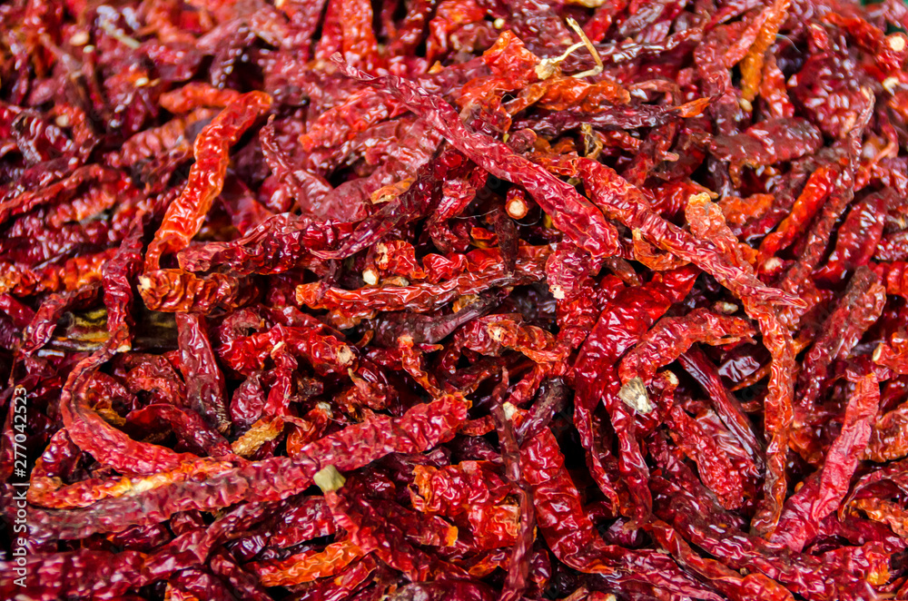Fototapeta premium Dry peppers - Red chilies background - Selective focus