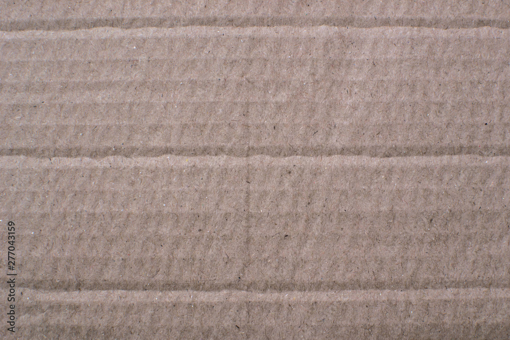 Fototapeta premium Thick paper, cardboard beige color with a pronounced texture, backdrop for design