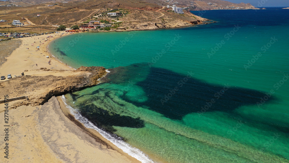 Aerial drone photo of famous tropical bay and beach of Ftelia in the centre of island of Mykonos, Cyclafes, Greece