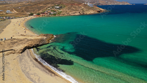 Aerial drone photo of famous tropical bay and beach of Ftelia in the centre of island of Mykonos, Cyclafes, Greece