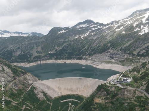 Dam and Reservoir of a Hydroelectric Powerplant in Stunning Alpine Landscape - Maltastaudamm and Kolbreinspeicher in Malta Valley, Carinthia, Austria photo