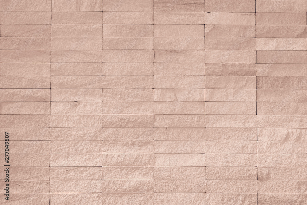 Fototapeta premium Rock tile wall texture background in light red brown