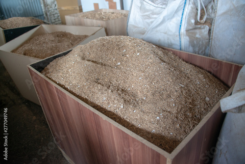 Taking photographs of wood plywood, used for making pellets