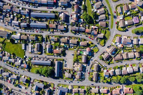 Fotografia, Obraz Aerial drone view of small winding sreets and roads in a residential area of a s