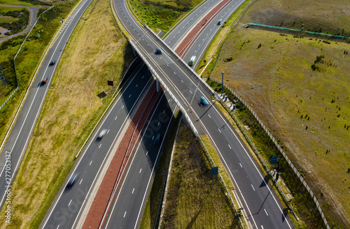 Принти на полотні Aerial drone view of motion blurred traffic on a new, dual carriageway road cons