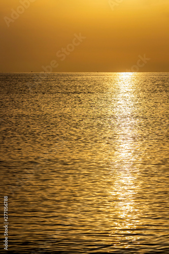 Golden summer Adriatic Sea sunrise coastline water surface with sun glitter at Lungomare Dante Alighieri beach in Senigallia, Province of Ancona, Marche, Italy