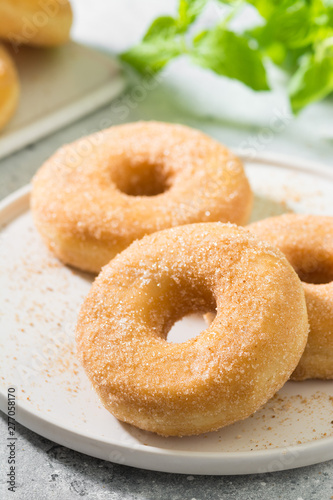 Doughnuts with sugar sprinkles. Light grey background