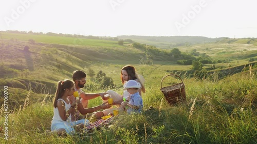 Happy family spends time on a picnic photo