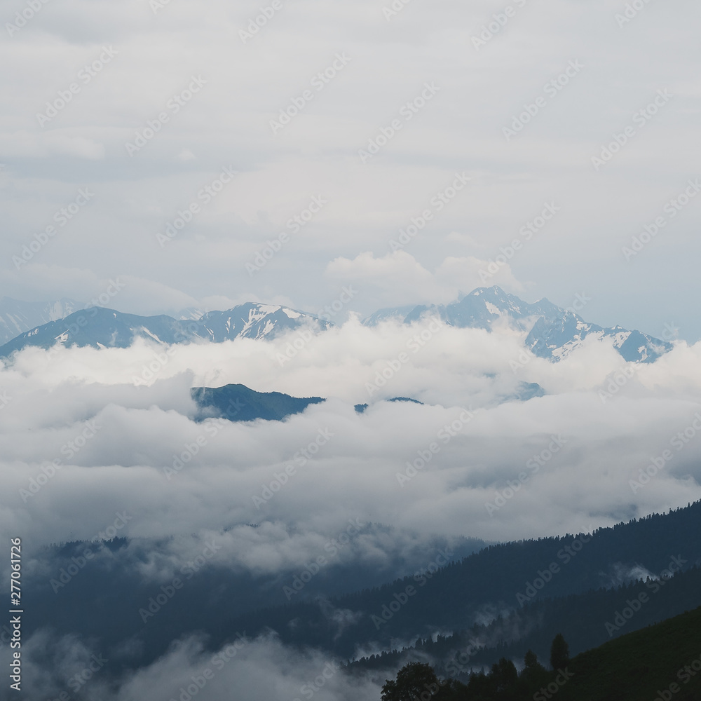 Storm clouds in a valley above a ridge. Republic of Adygea Storm clouds in a valley above a ridge. Republic of Adygea